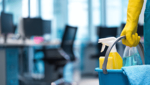 Professional cleaning crew sanitizing office desks in Lancaster PA