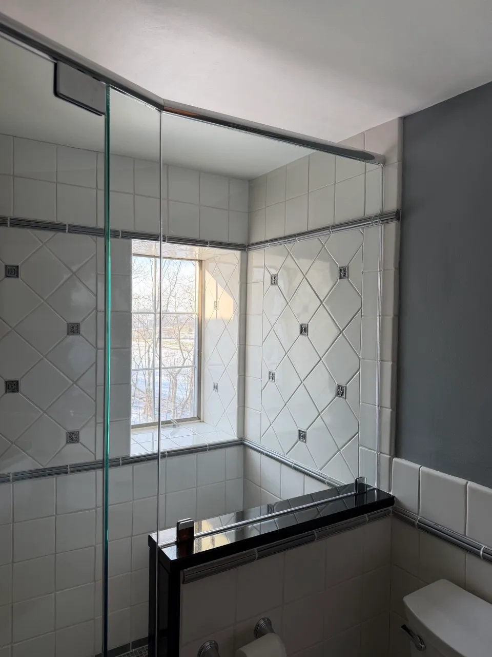 Glass shower enclosure and tiled walls cleaned streak-free in Lancaster, PA