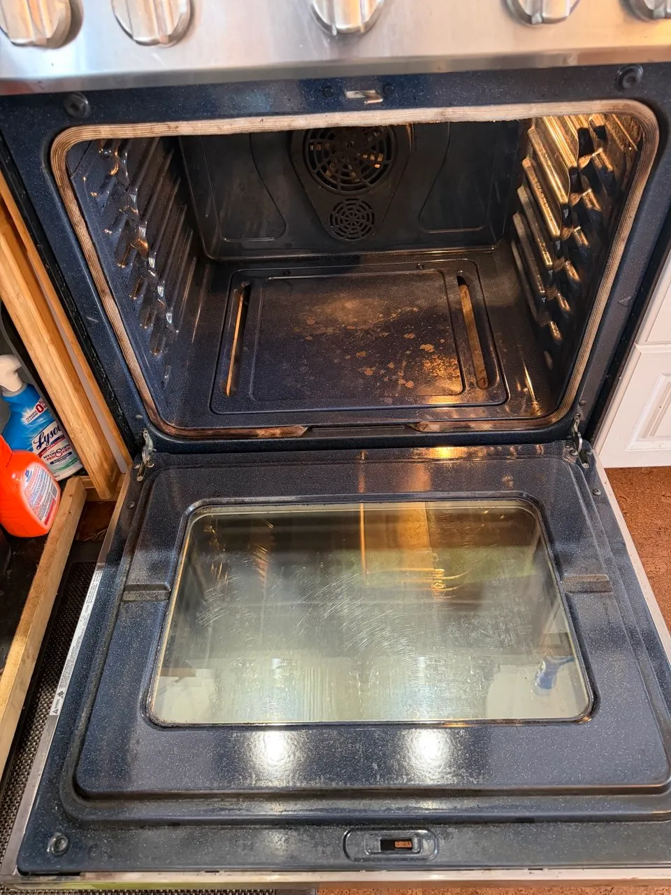 Oven interior with baked-on grease before a deep clean